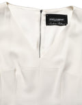 Robe midi sans manches Dolce & Gabbana à motif léopard blanc, coupe ajustée et élégante, parfaite pour une occasion chic.