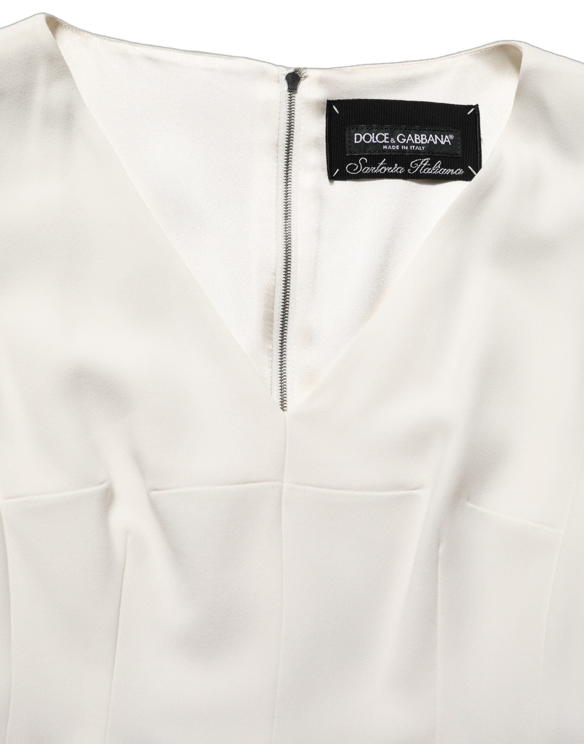 Robe midi sans manches Dolce & Gabbana à motif léopard blanc, coupe ajustée et élégante, parfaite pour une occasion chic.