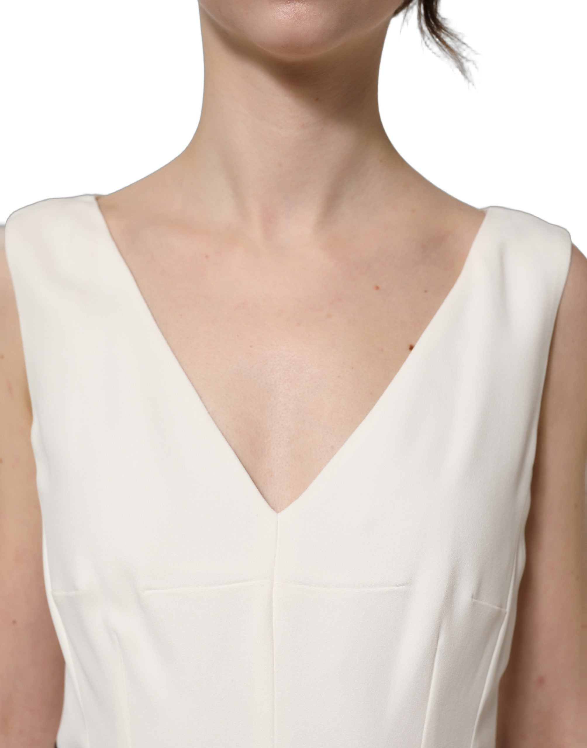 Robe midi sans manches en dentelle blanche à motif léopard, marque Dolce & Gabbana, ajustée et élégante.