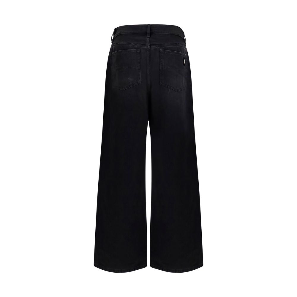 Jeans en denim noir Amiri en coton, coupe classique, avec détails de couture visibles, parfaits pour un style décontracté.