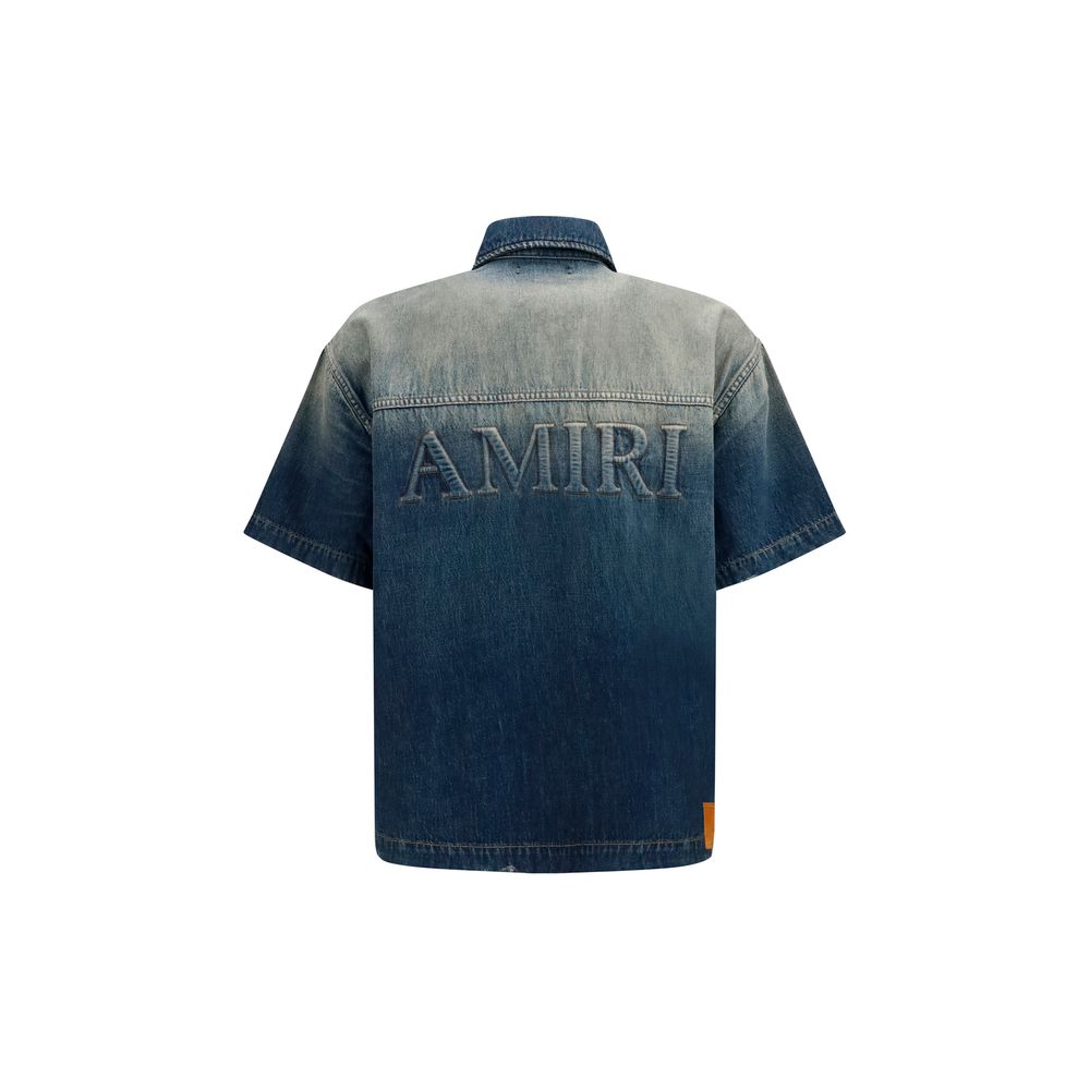Chemise en denim bleu Amiri avec boutons, col classique et manches longues, vue de face.