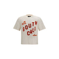 T-shirt en coton beige de la marque Amiri, coupe classique avec col rond, illustration discrète sur le devant.