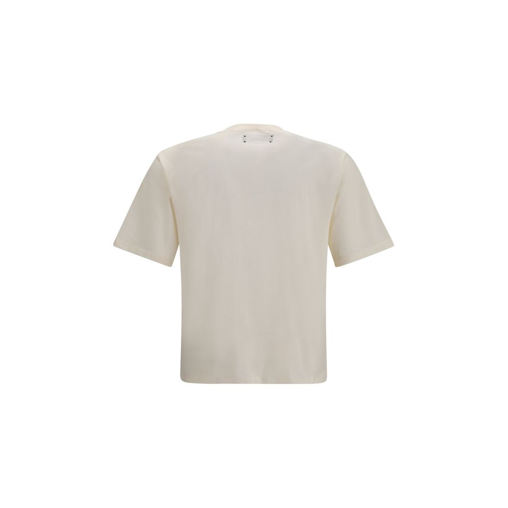T-shirt beige en coton de la marque Amiri, coupe classique, porté sur mannequin, détail du col rond.