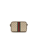 Sac à bandoulière en coton beige de Gucci, avec détails élégants et logo de la marque visible.