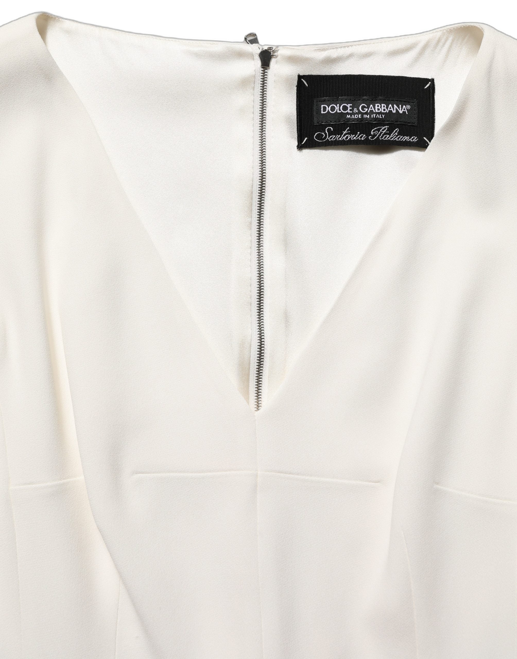 Robe droite sans manches Dolce & Gabbana blanche à imprimé léopard, longueur midi, élégante et sophistiquée.