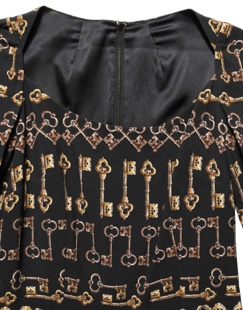 Robe midi noire Dolce & Gabbana à manches longues avec motif clé, coupe ajustée et élégante, style chic et sophistiqué.