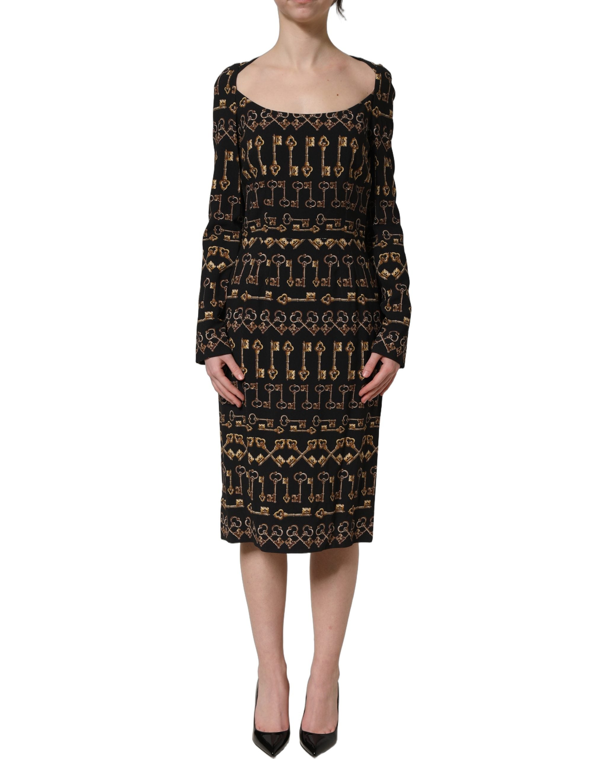 Robe midi noire Dolce & Gabbana à manches longues avec motif clé, coupe ajustée et style élégante.