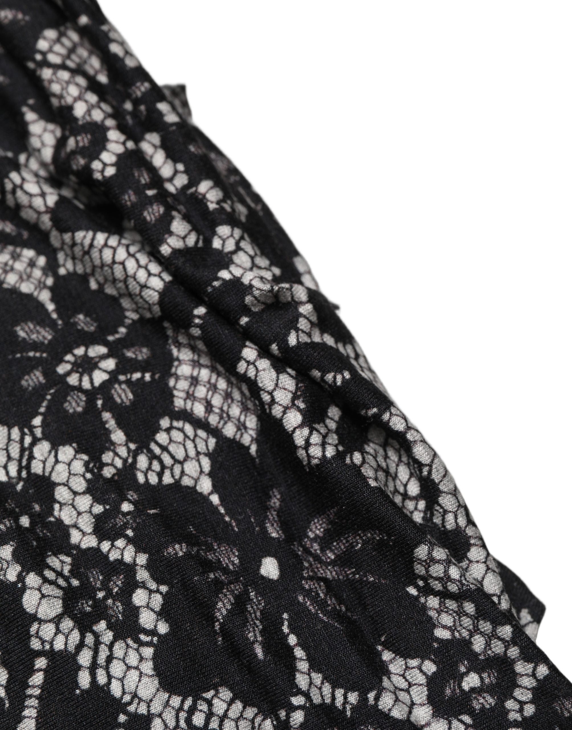 Robe midi sans manches Dolce & Gabbana noire et blanche avec dentelle florale, élégante et féminine.