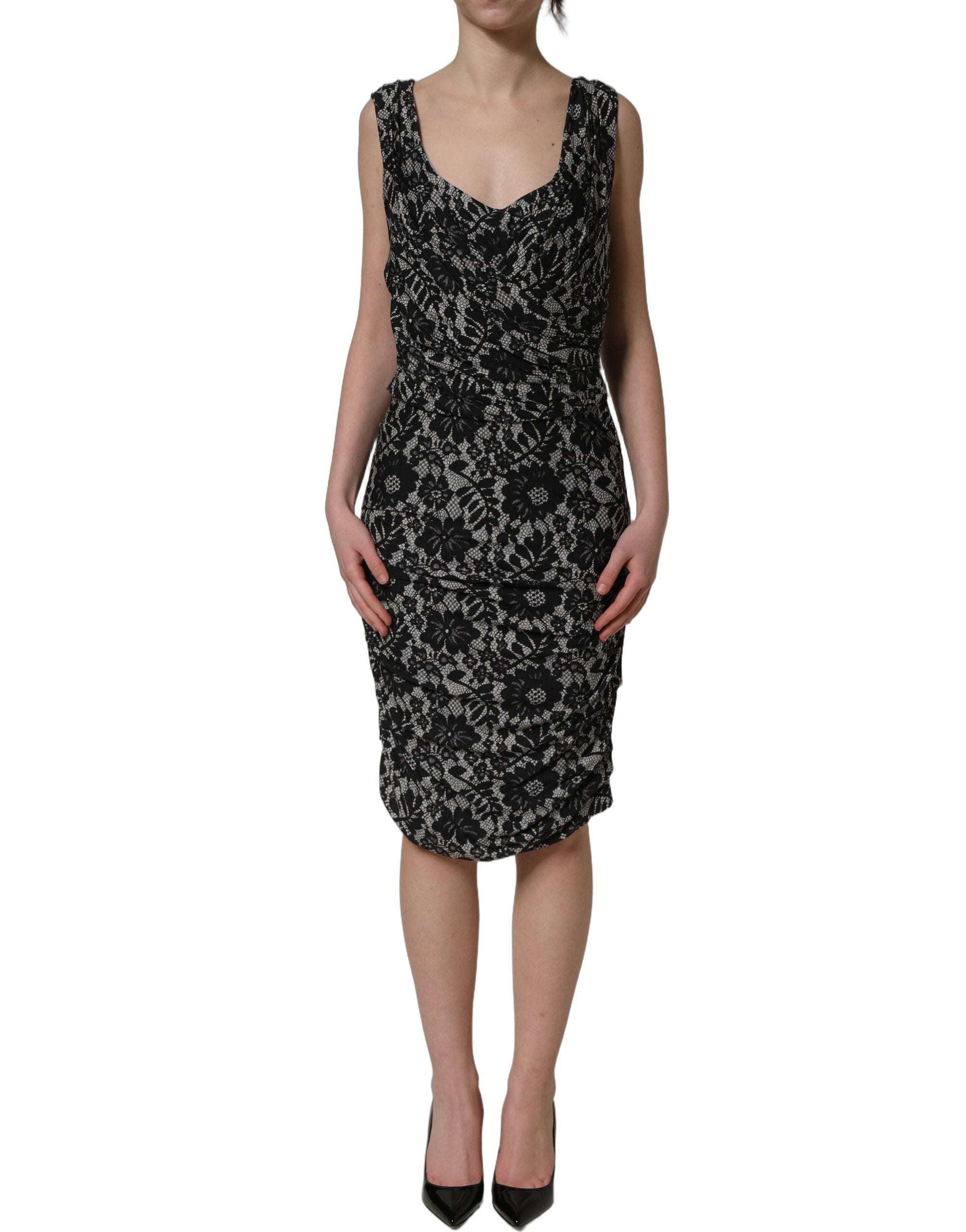 Robe midi sans manches Dolce & Gabbana noire et blanche avec dentelle florale, élégante et féminine, vue de face.