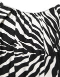 Robe mini en soie noire et blanche à rayures zèbre avec fronces de Dolce & Gabbana, élégante et sophistiquée.