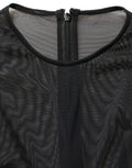 Robe longue noire en dentelle transparente Dolce & Gabbana, manches longues, coupe moulante, élégante et sophistiquée.