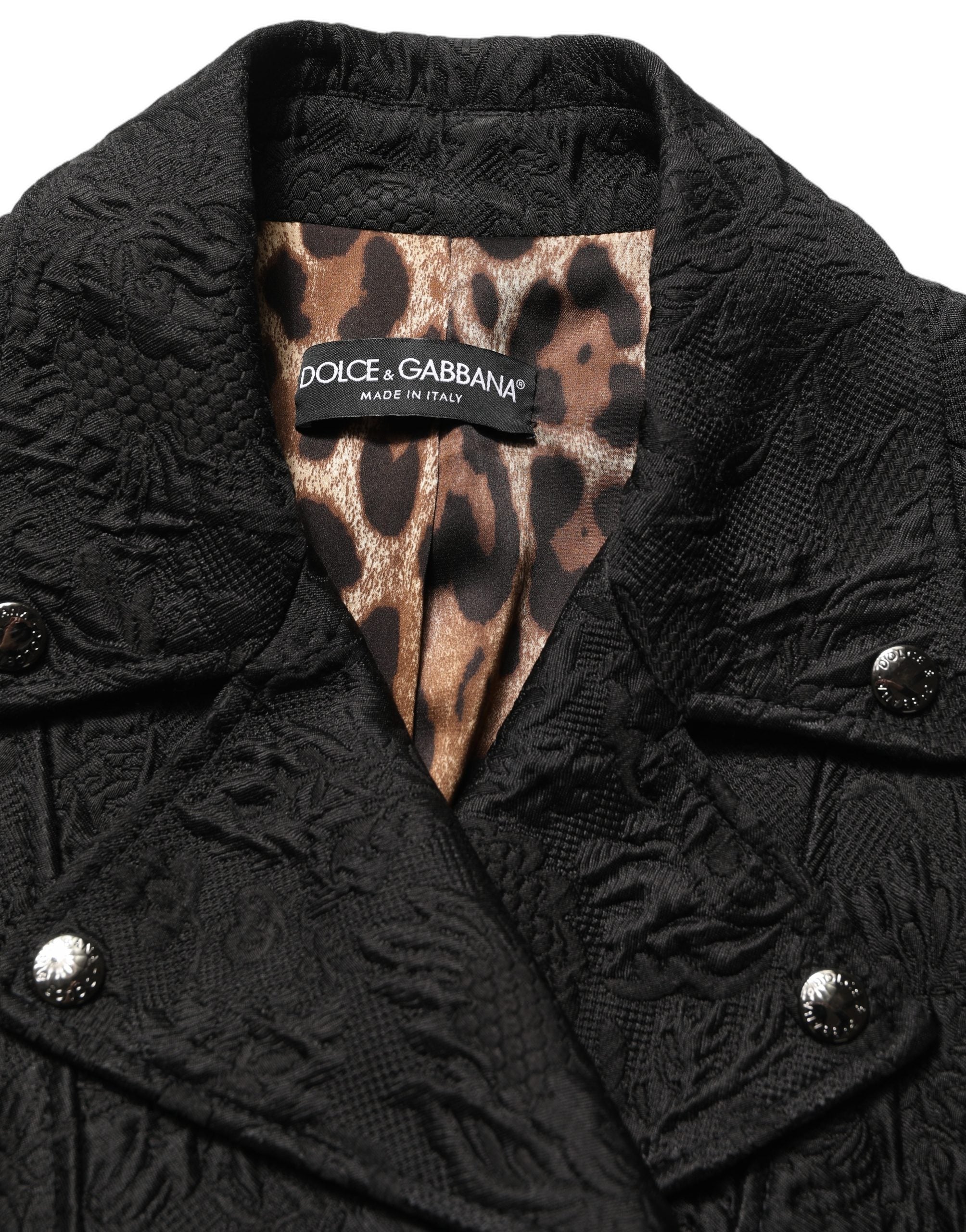 Veste biker en brocart noir à fleurs de Dolce & Gabbana, style élégant avec détails floraux et coupe moderne.
