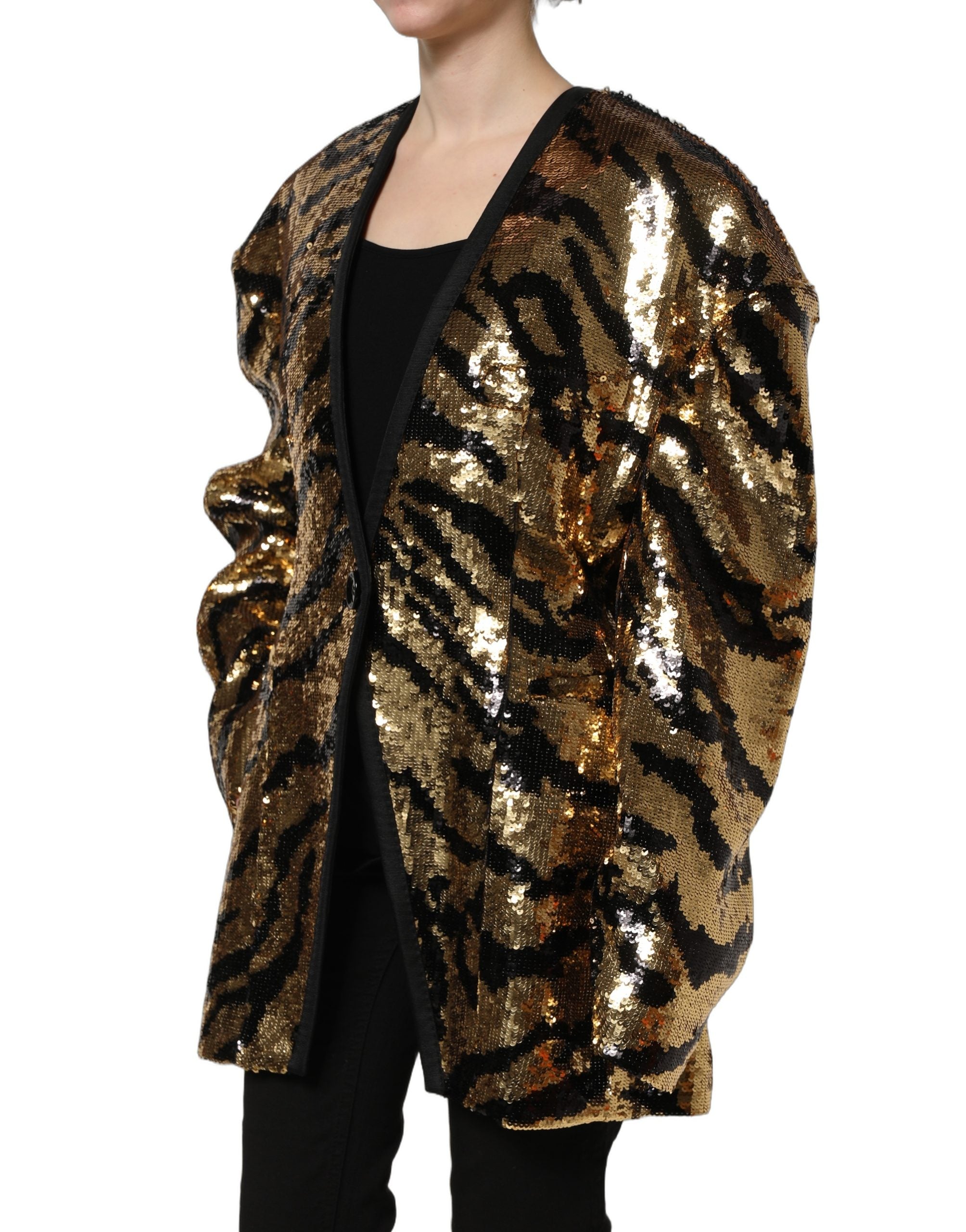 Blazer Dolce & Gabbana en sequins noirs et dorés avec rayures de tigre, coupe élégante et détails brillants.