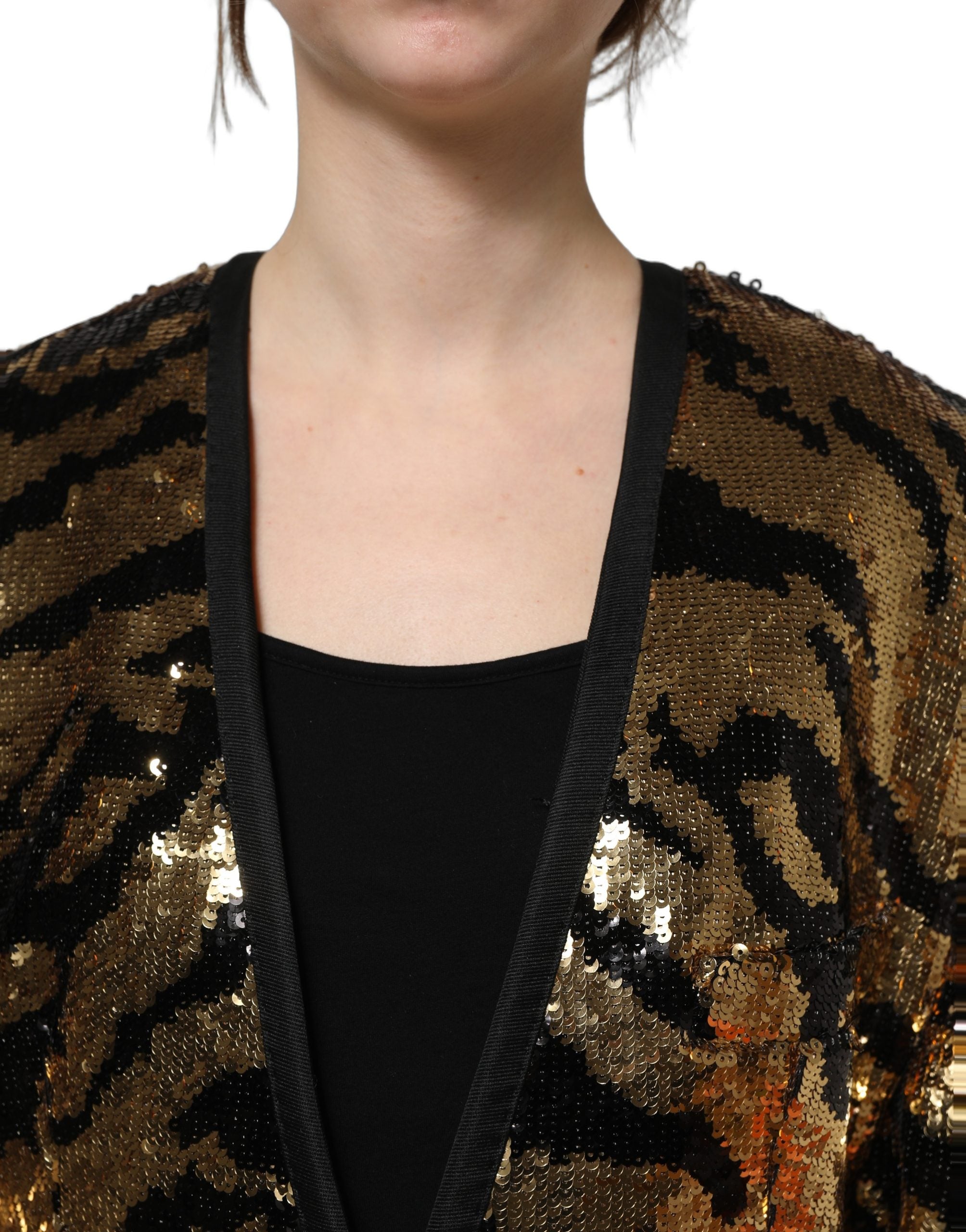 Blazer Dolce & Gabbana à rayures de tigre en sequins noirs et dorés, veste élégante avec détail brillant et style audacieux.
