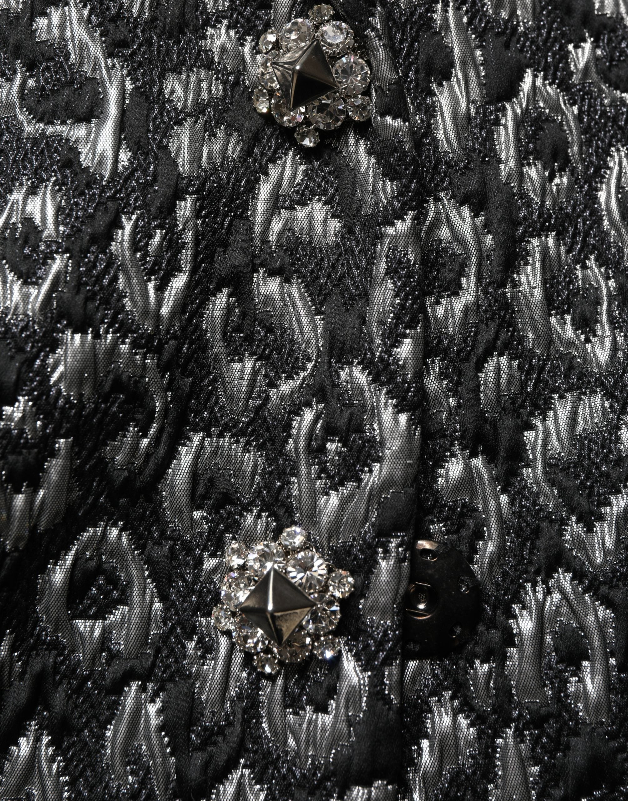 Veste en jacquard noir et argent avec motif léopard de Dolce & Gabbana, coupe élégante et tissu sophistiqué.