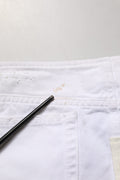 Mini jupe en denim blanc délavé de Dolce & Gabbana, en coton, avec un style usé tendance, pour un look décontracté et chic.