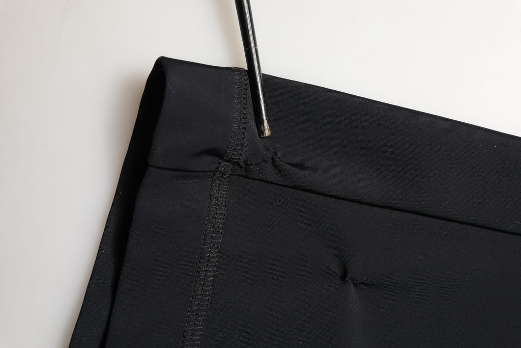 Jupe midi noire en jersey stretch Dolce & Gabbana DGVIB3, coupe crayon élégante et ajustée, vue de face.