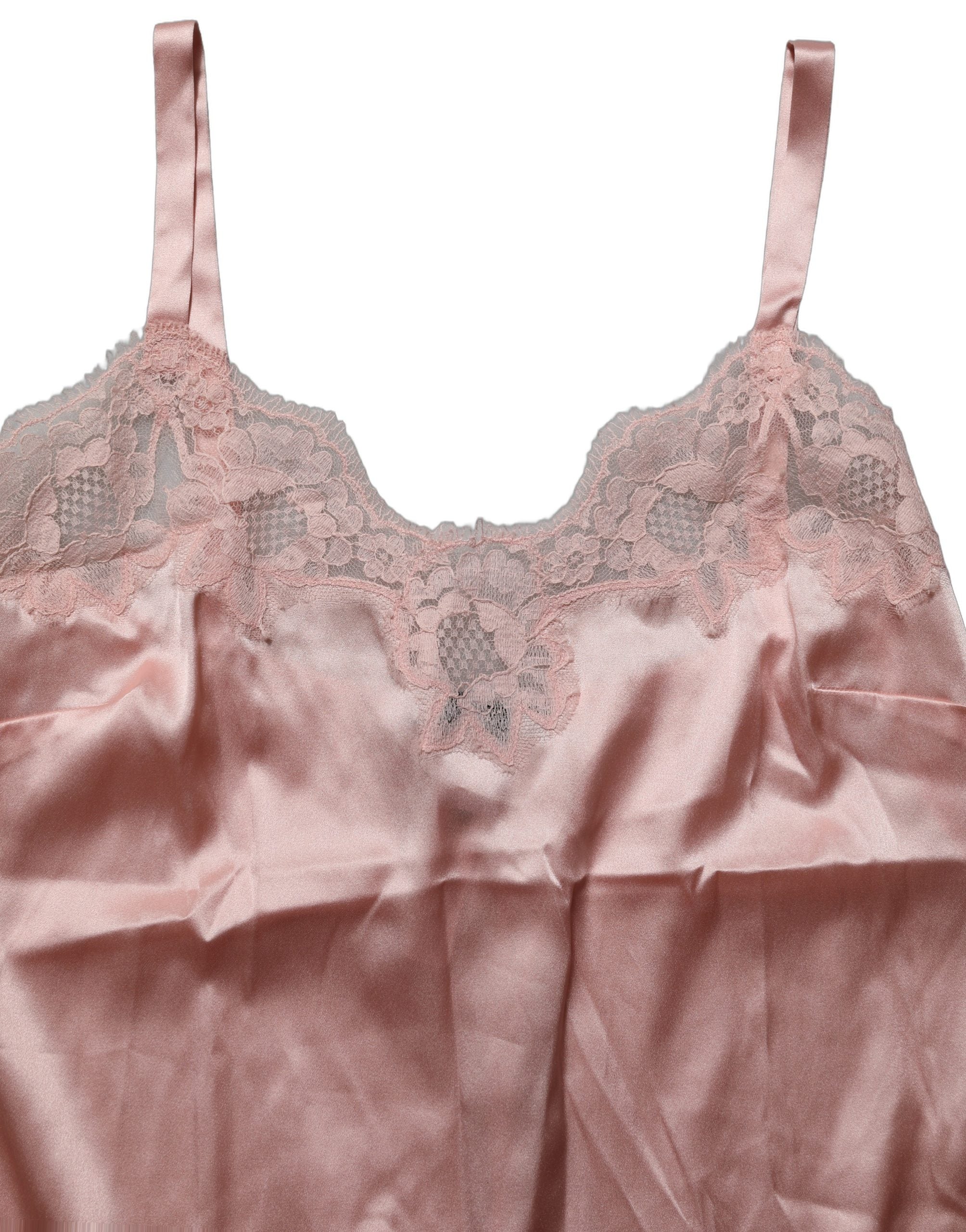 Lingerie Dolce & Gabbana en dentelle rose clair avec motifs floraux, haut élégant et féminin, vu en gros plan.