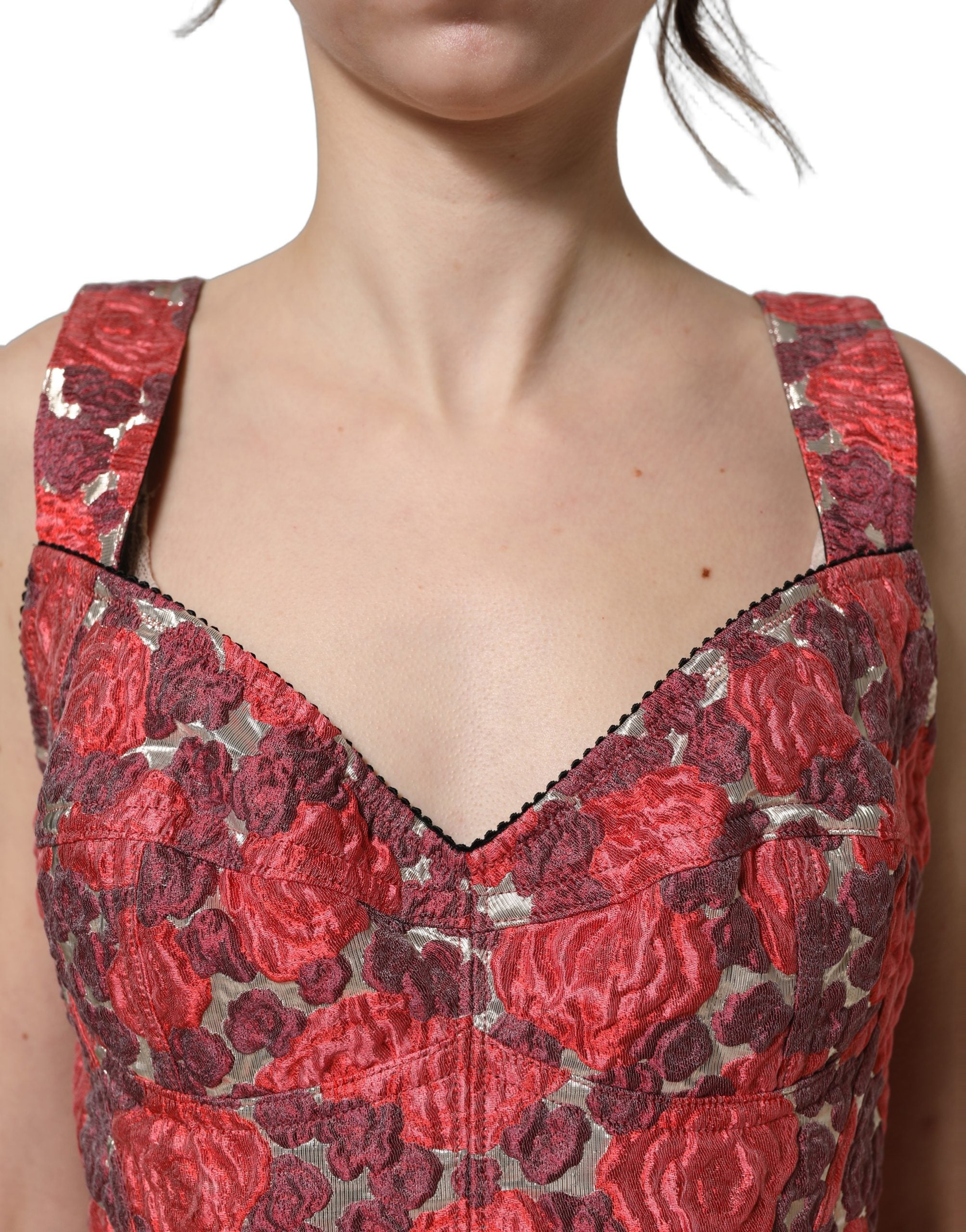 Débardeur court Dolce & Gabbana à fleurs multicolores, bustier crop top en tissu léger avec motifs floraux vibrants.