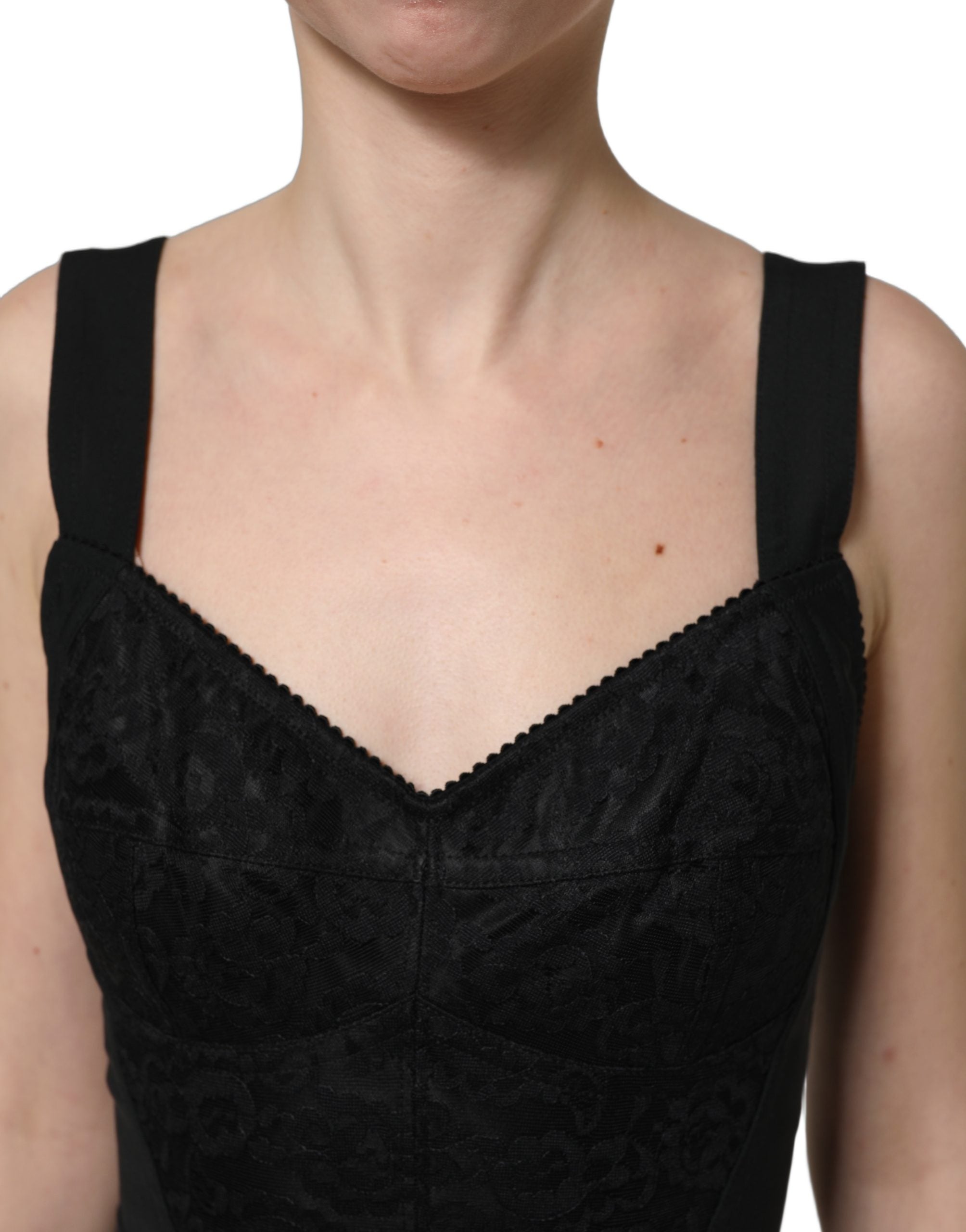 Corset bodycon en dentelle florale noire Dolce & Gabbana, ajusté et élégant, avec détails en dentelle fine et finition sophistiquée.
