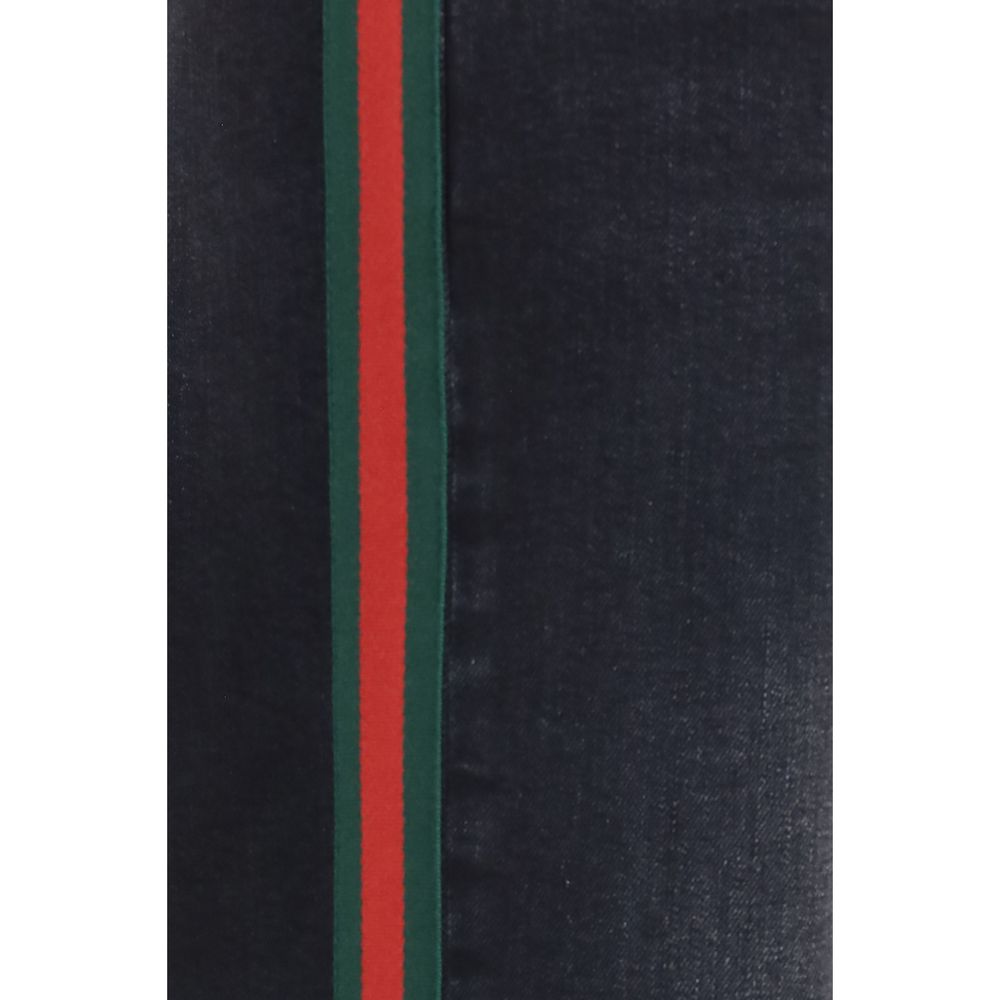 Jeans straight en coton noir de Gucci, vue de face, avec coupe classique et détails de couture visibles.