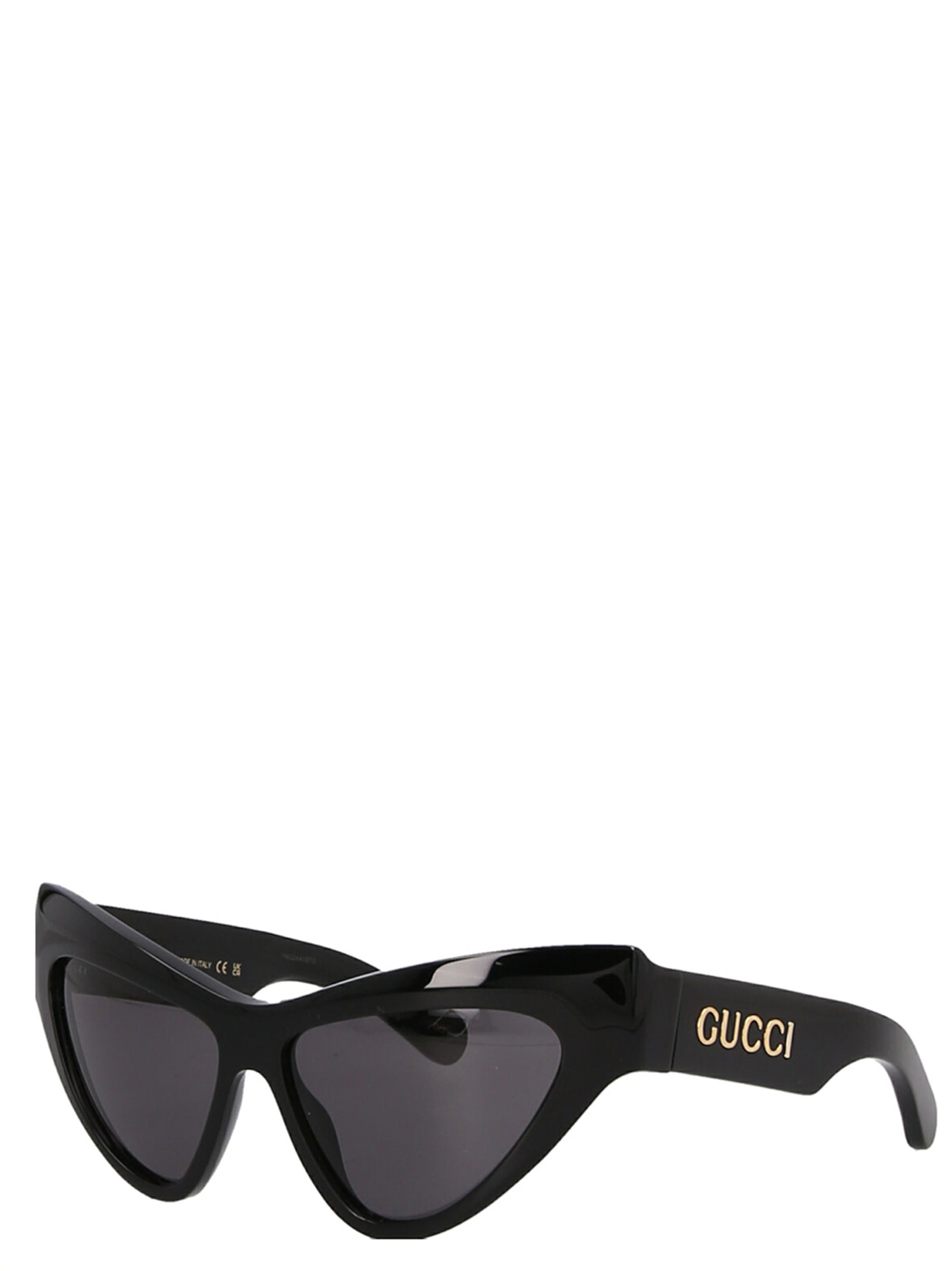 Lunettes de soleil Gucci noires en acétate avec monture élégante et design sophistiqué visible sur l'image.