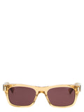 Lunettes de soleil Saint Laurent beige en acétate, mode élégante avec monture incurvée et verres teintés, pour un style sophistiqué.