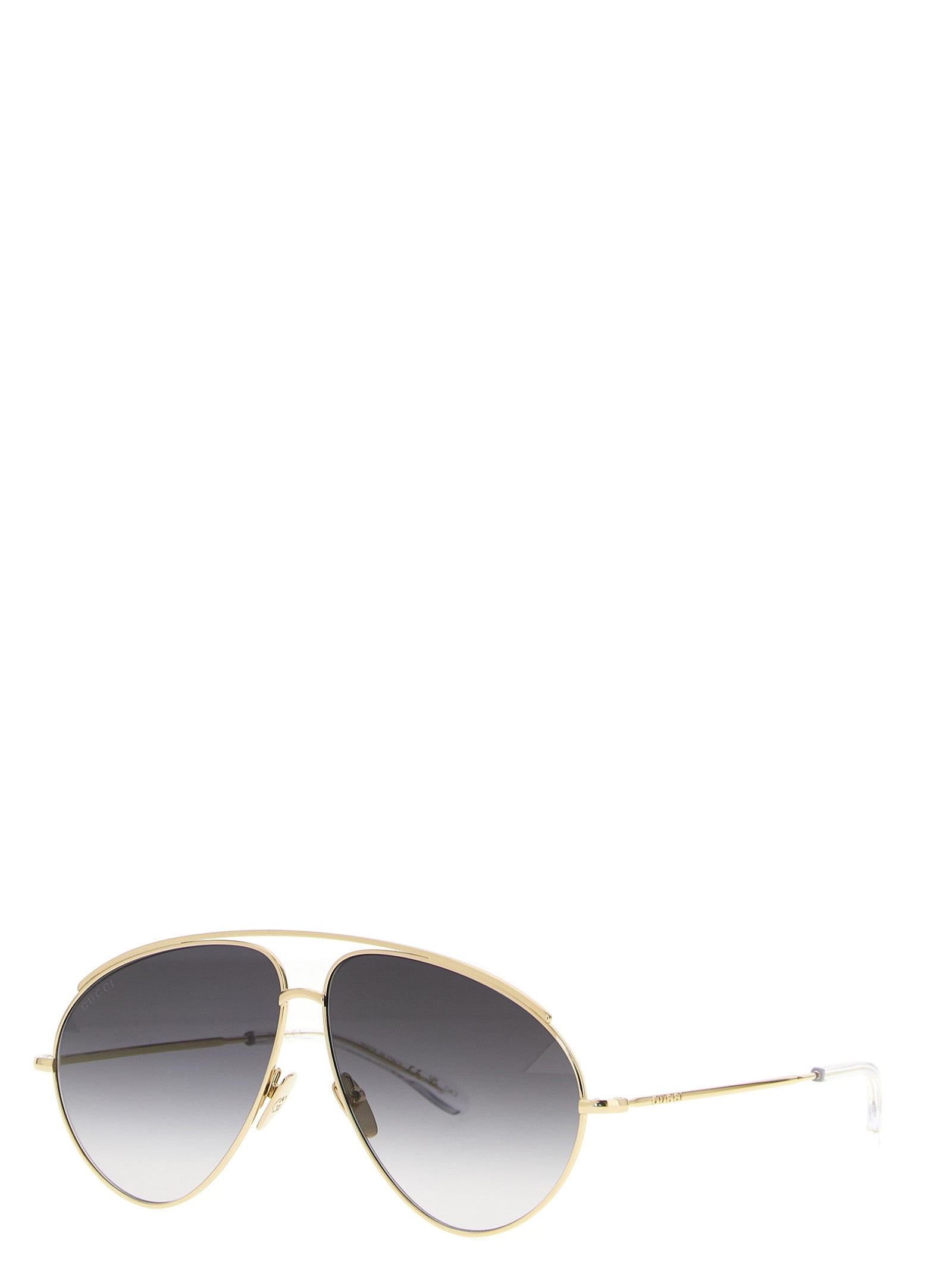 Lunettes de soleil en métal doré Gucci avec monture élégante et design moderne, vues de face.