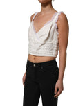 Débardeur court en coton blanc avec broderie en dentelle, par Dolce & Gabbana, visible avec détails fins et finition élégante.