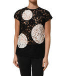 Blouse courte Dolce & Gabbana en dentelle florale noire et blanche à manches courtes, élégance raffinée.