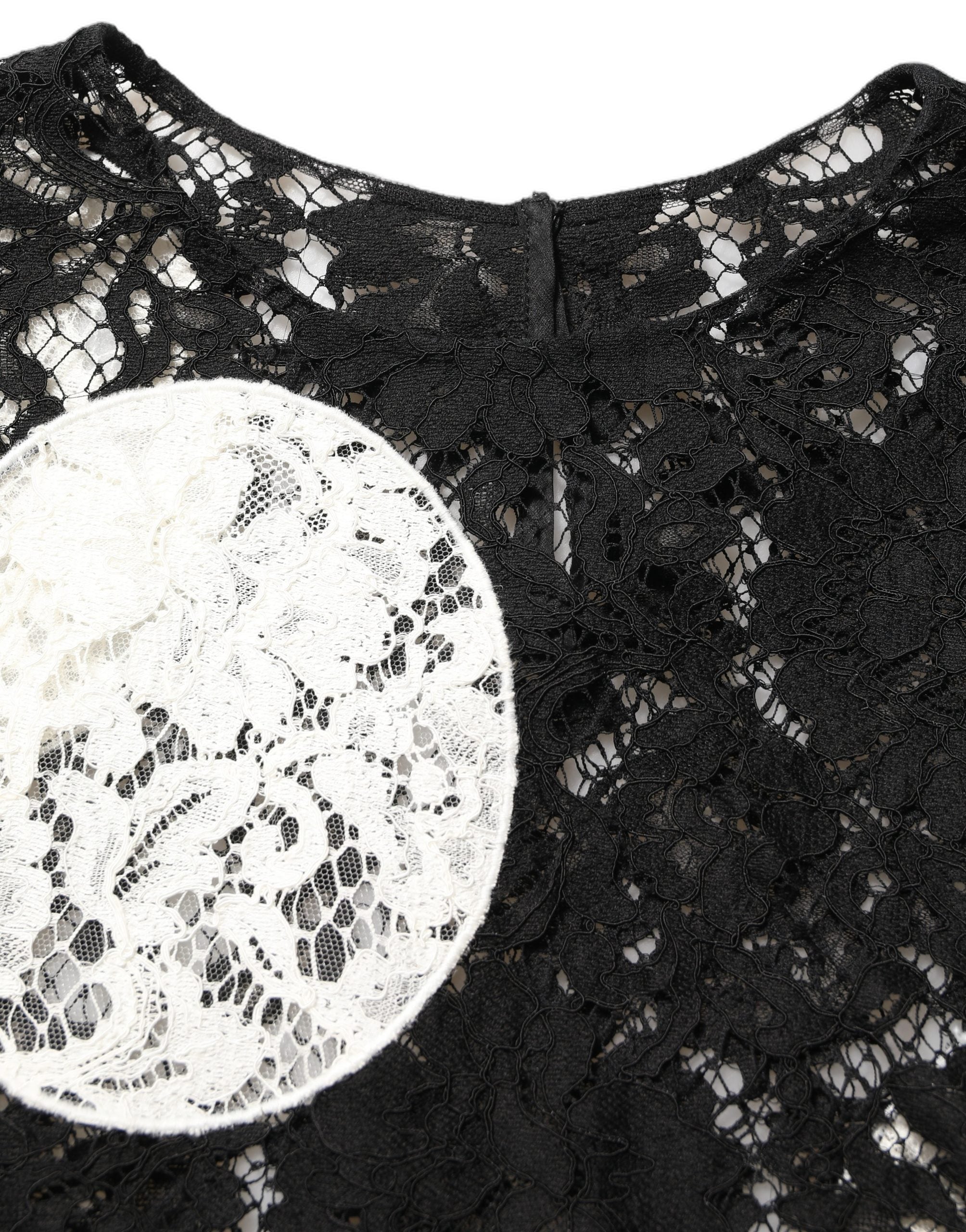 Blouse courte à manches courtes Dolce & Gabbana en dentelle florale noire et blanche, élégante et raffinée.