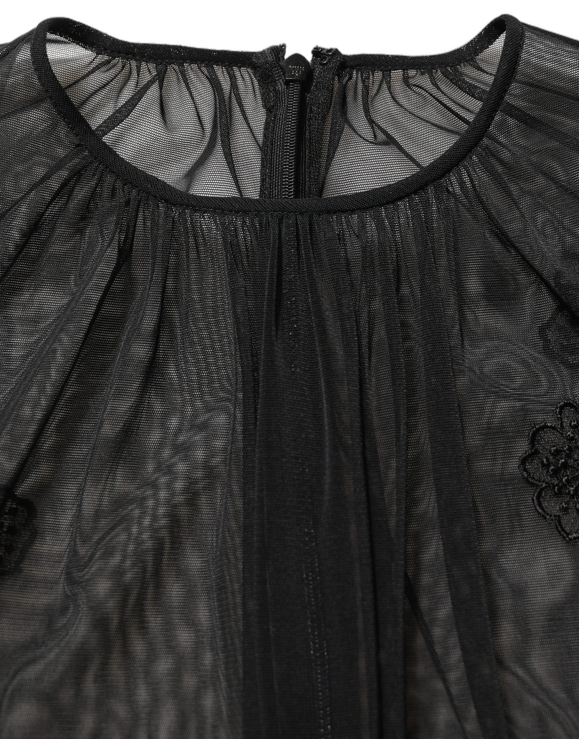 Blouse noire en polyester à maille transparente de Dolce & Gabbana, col rond, style élégant et moderne.