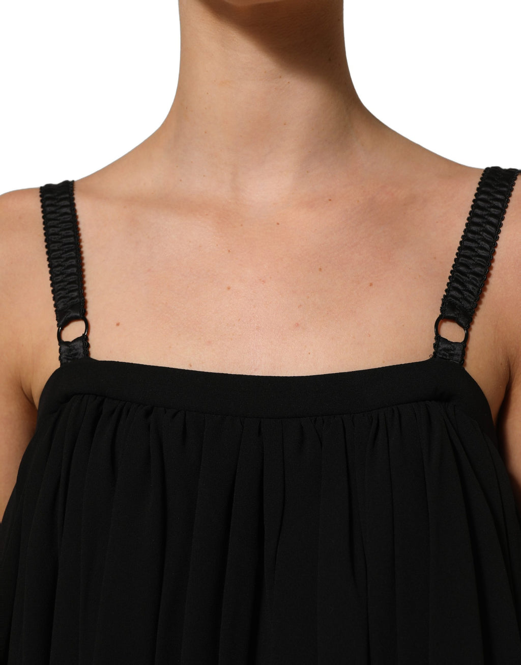 Top sans manches en dentelle florale noire de Dolce & Gabbana, blouse élégante avec détails raffinés.