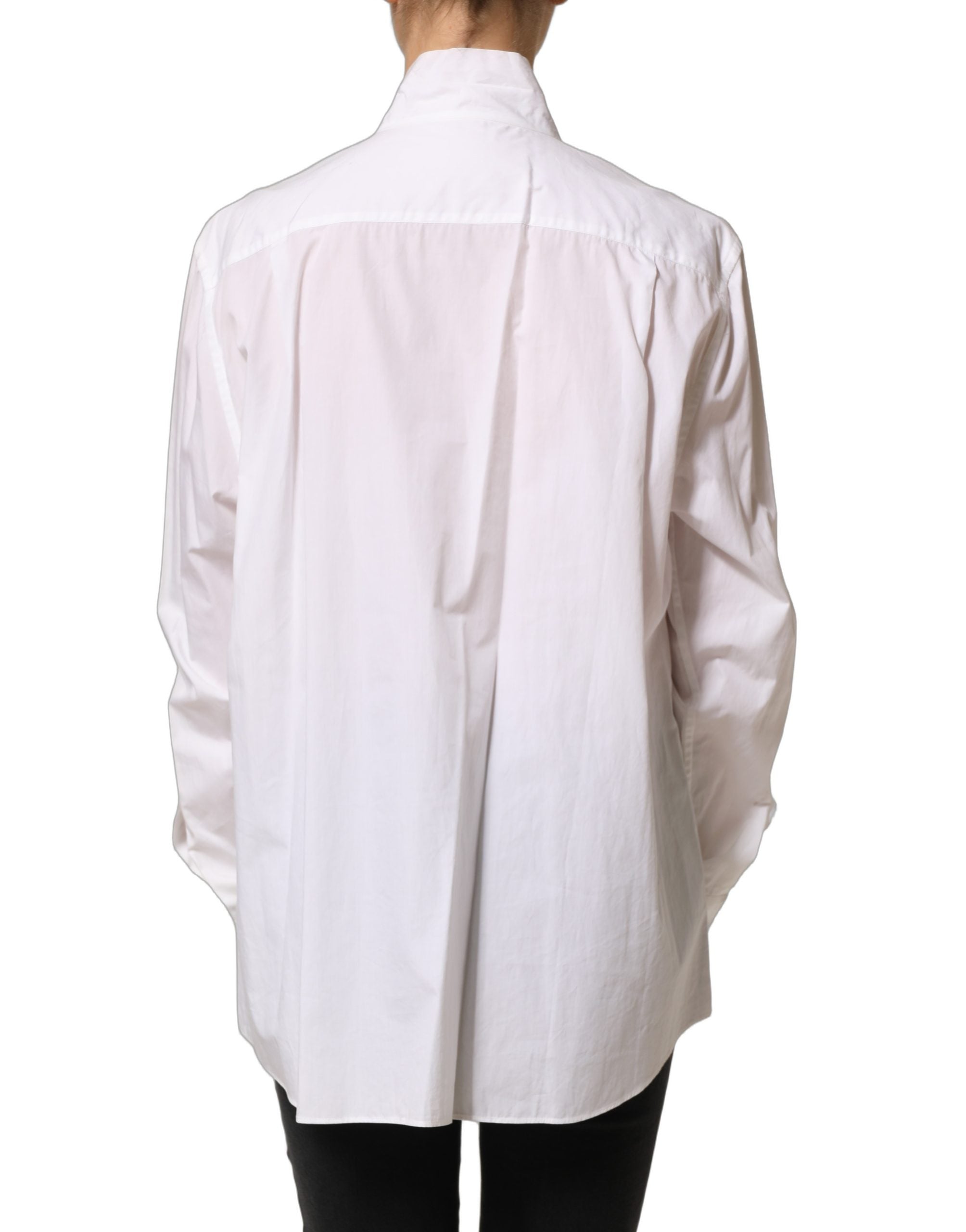Blouse Dolce & Gabbana blanche à col montant plissé, manches longues avec volants, style élégant et sophistiqué.