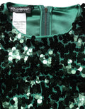 Blouse courte Dolce & Gabbana à manches longues vertes avec sequins, style élégant et brillant.