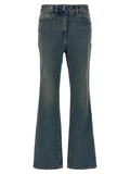 Jeans bootcut en coton bleu Givenchy, coupe décontractée, détails classiques, porté sur un modèle.