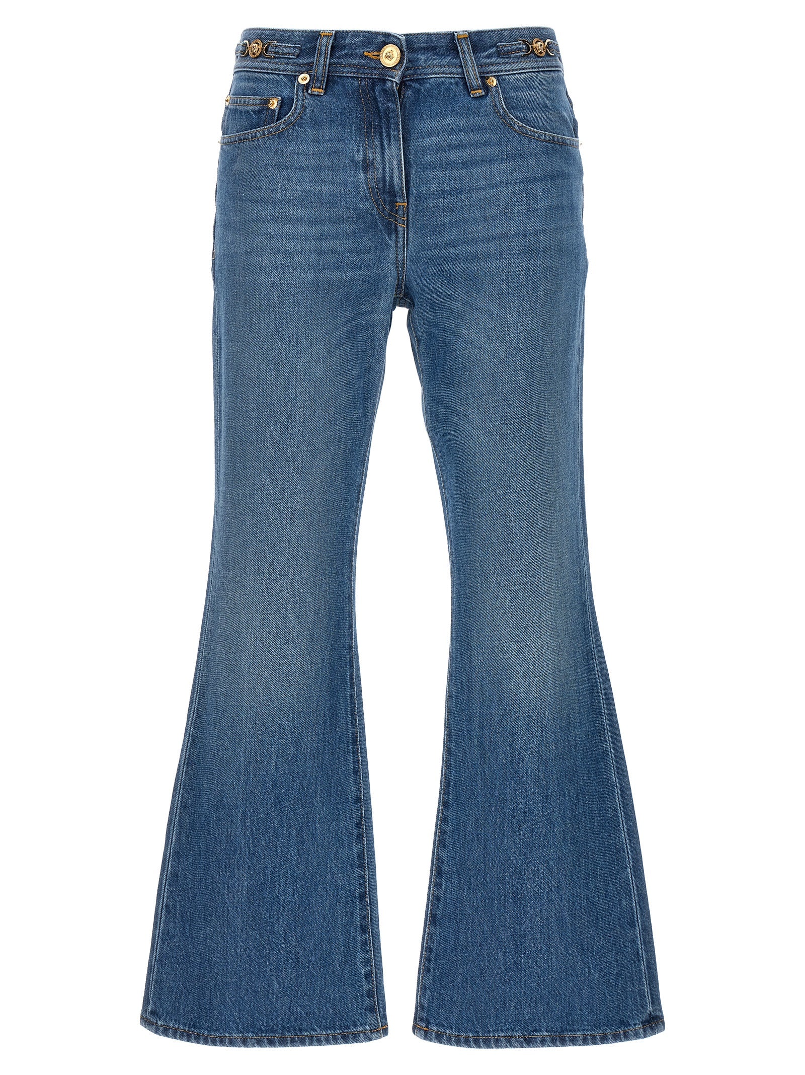 Jean évasé en coton bleu de la marque Versace, avec coupe fluide et détails stylés.