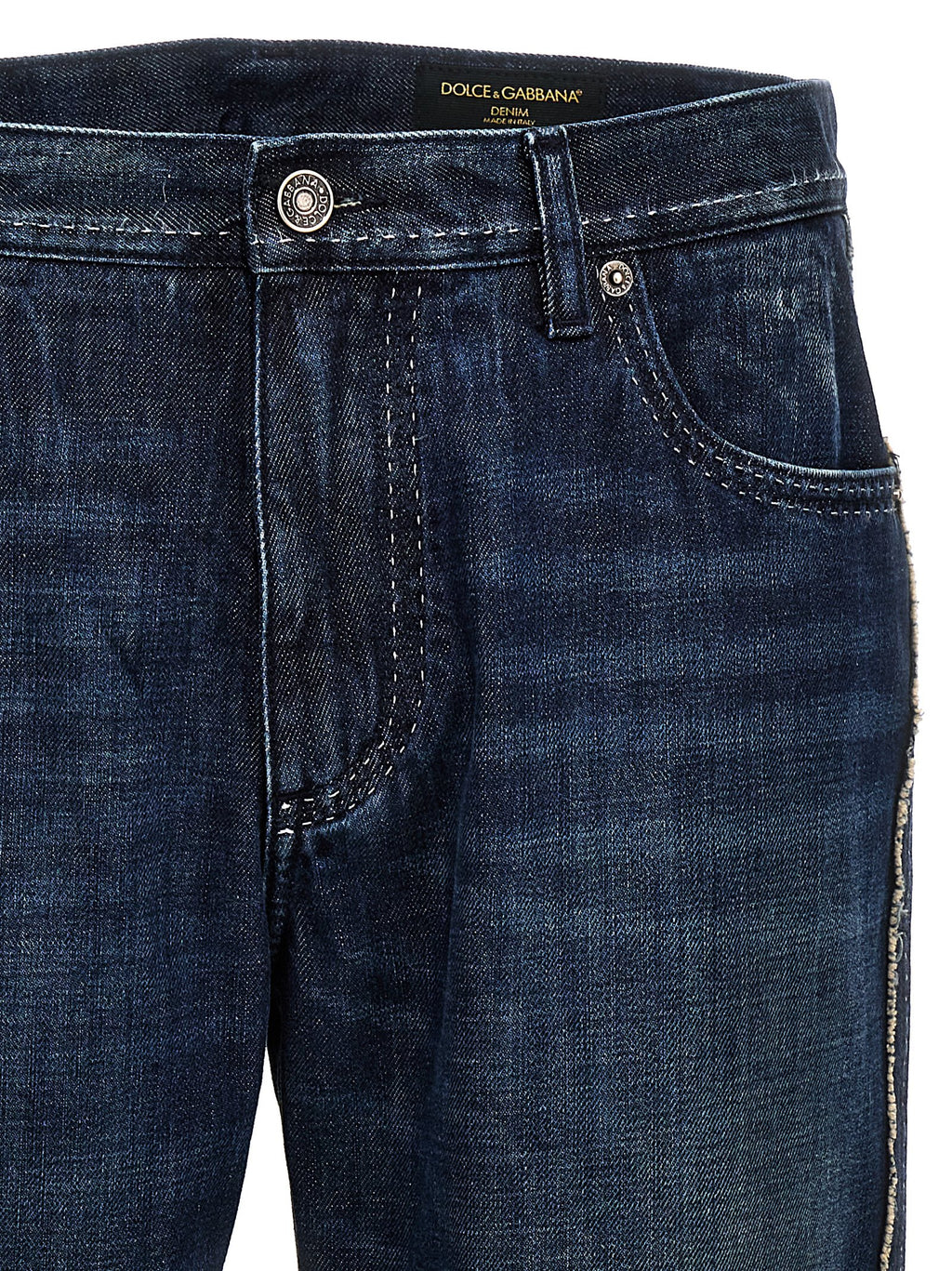 Jeans skinny en coton bleu Dolce & Gabbana avec coupe ajustée et détails modernes, visibles sur l’image.