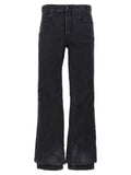 Jeans évasés en coton noir de Balenciaga, style décontracté avec coupe fluide et détails tendance.