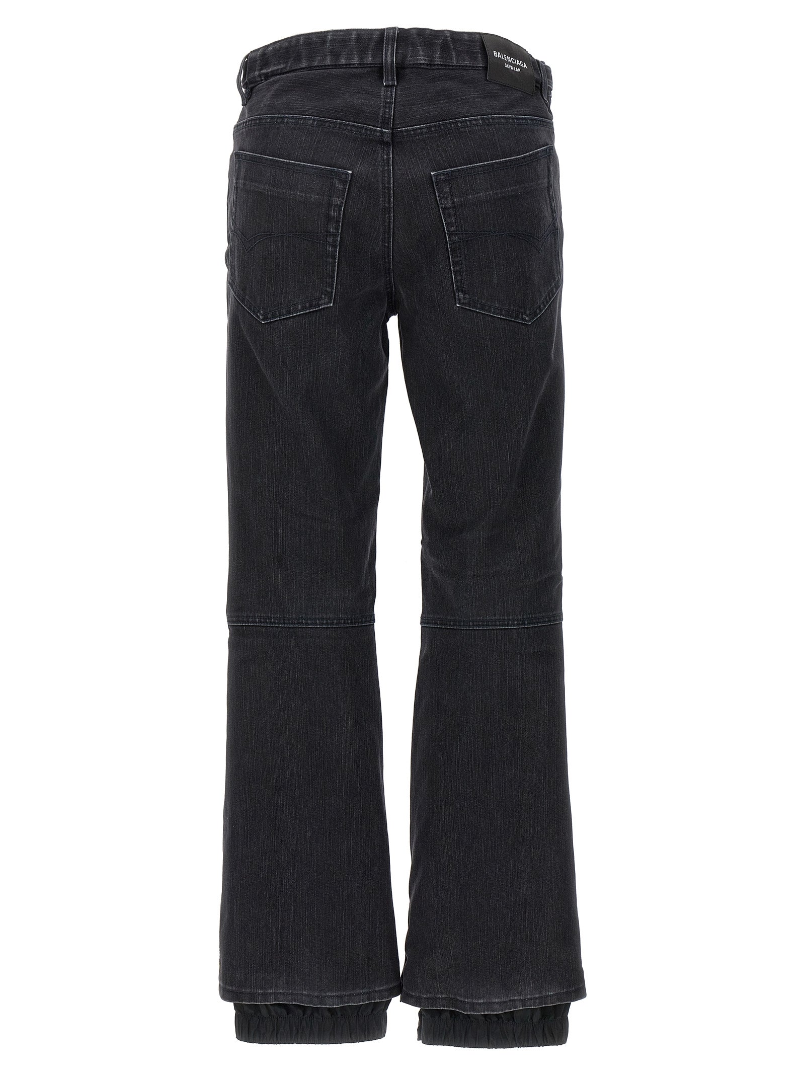 Jeans évasés en coton noir de Balenciaga, denim décontracté avec coupe fluide et détails modernes.