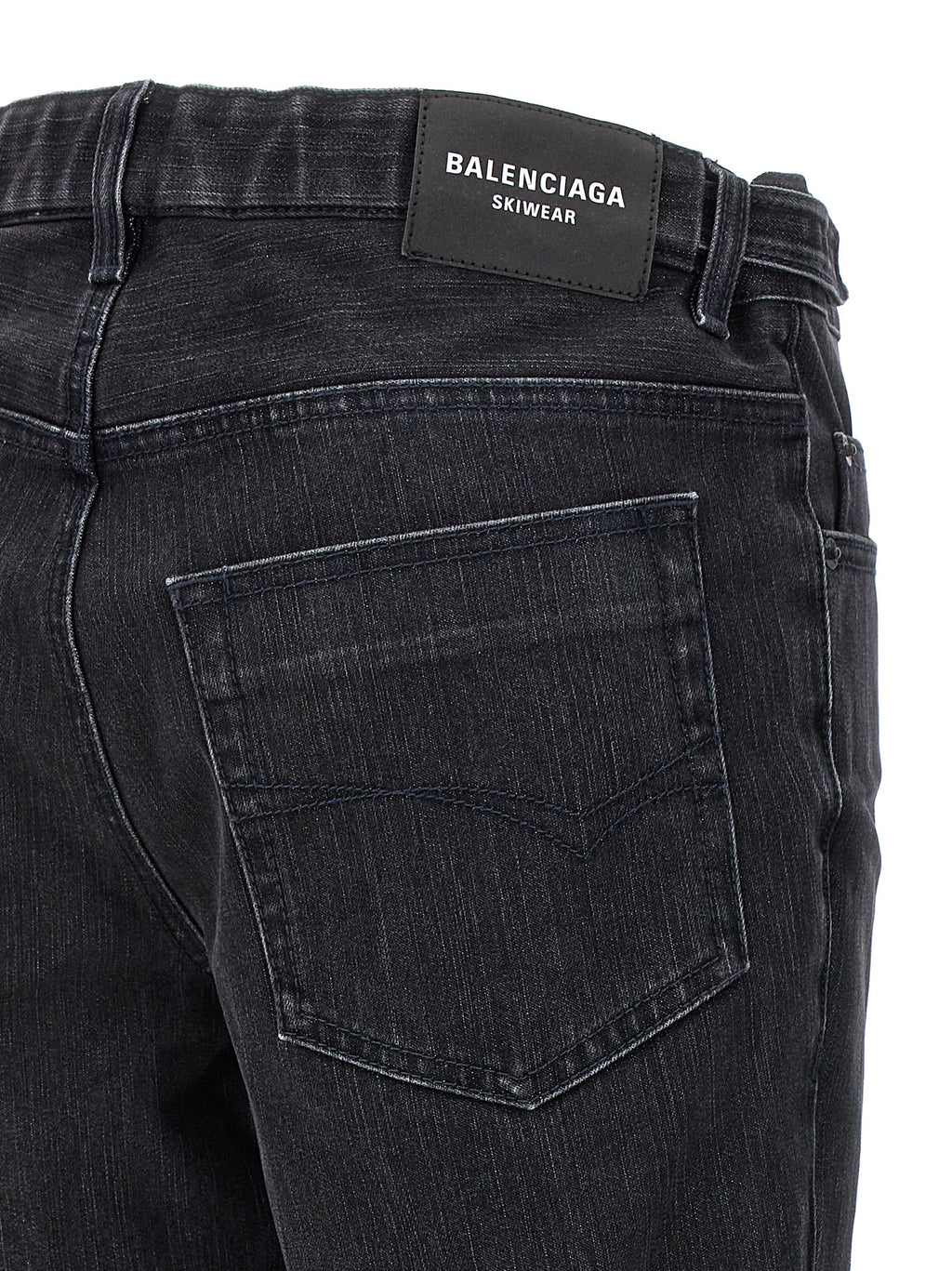 Jeans évasés en coton noir de la marque Balenciaga, style décontracté et tendance, avec coupe ample et détails modernes.