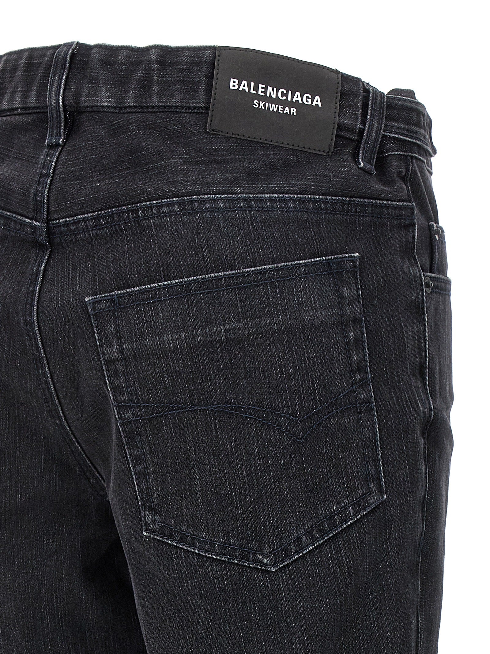 Jeans évasés en coton noir de la marque Balenciaga, style décontracté et tendance, avec coupe ample et détails modernes.