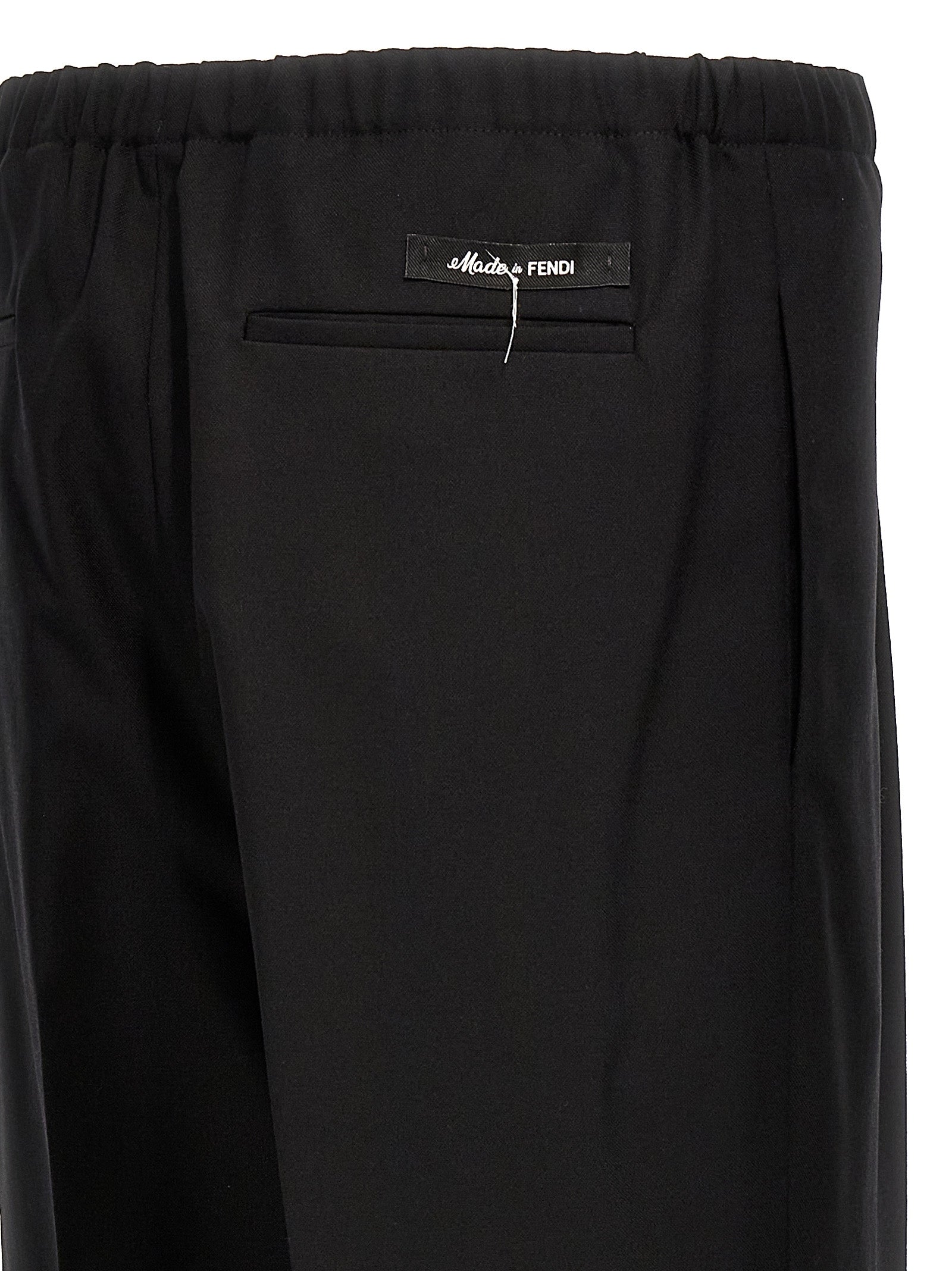 Pantalon de costume noir en laine vierge Fendi, coupe élégante et moderne, parfait pour un look sophistiqué.