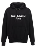 Sweatshirt en coton bicolore Balmain avec logo, coupe décontractée et détails modernes, porté sur un modèle.