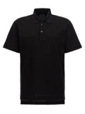 Chemise polo noire en coton de Givenchy, vue de face, avec col classique et logo discret sur la poitrine.