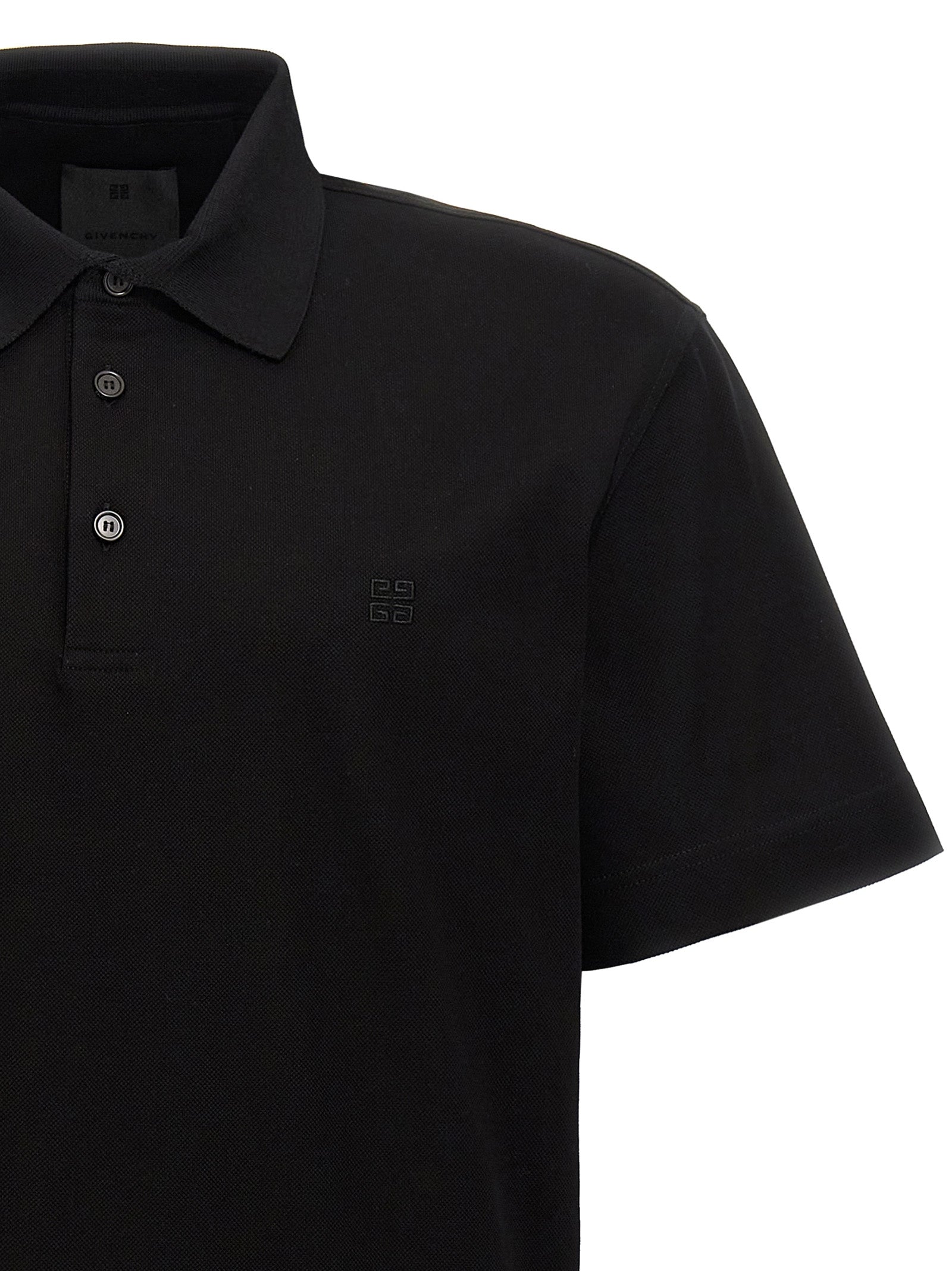 Polo en coton noir Givenchy, chemise élégante à col classique et manches courtes, vue de face.