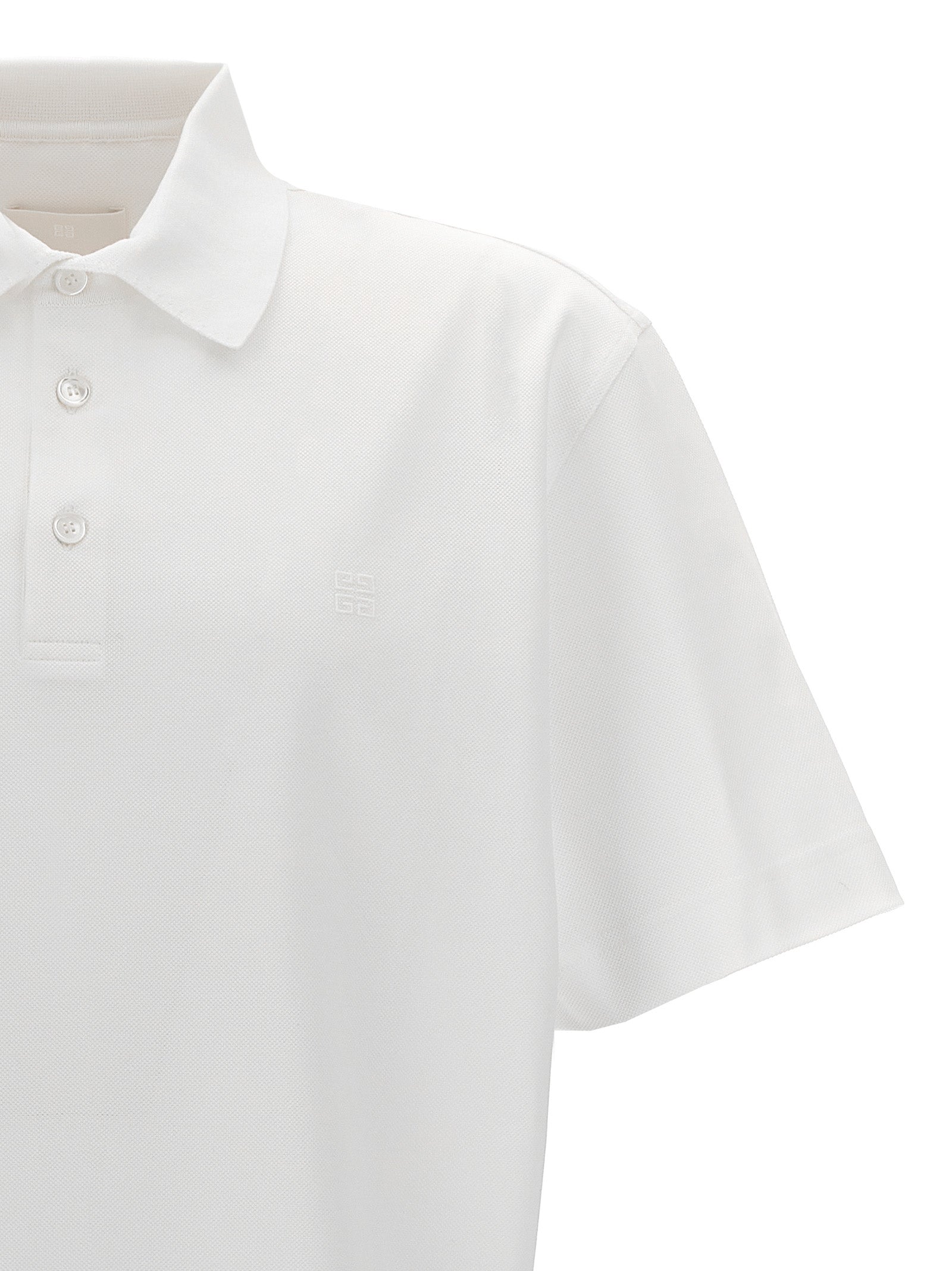 Chemise polo blanche en coton de la marque Givenchy, vue de face avec col et boutons visibles.