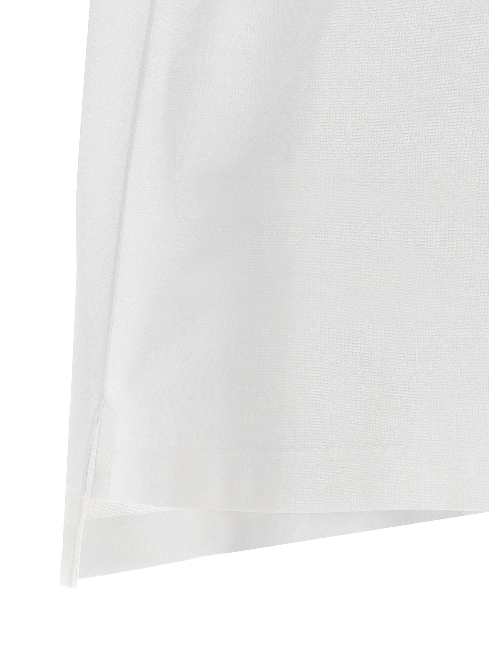 Chemise polo blanche en coton Givenchy, vue de face, avec col classique et logo discret sur la poitrine.