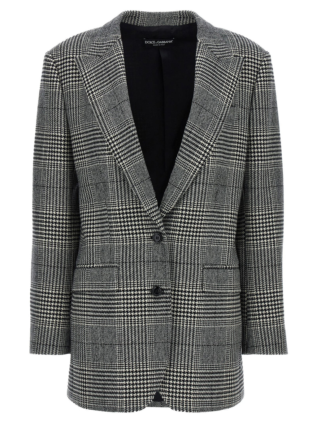 Blazer en laine bicolore Dolce & Gabbana porté sur mannequin, détails élégants et coupe moderne visible dans l'image.