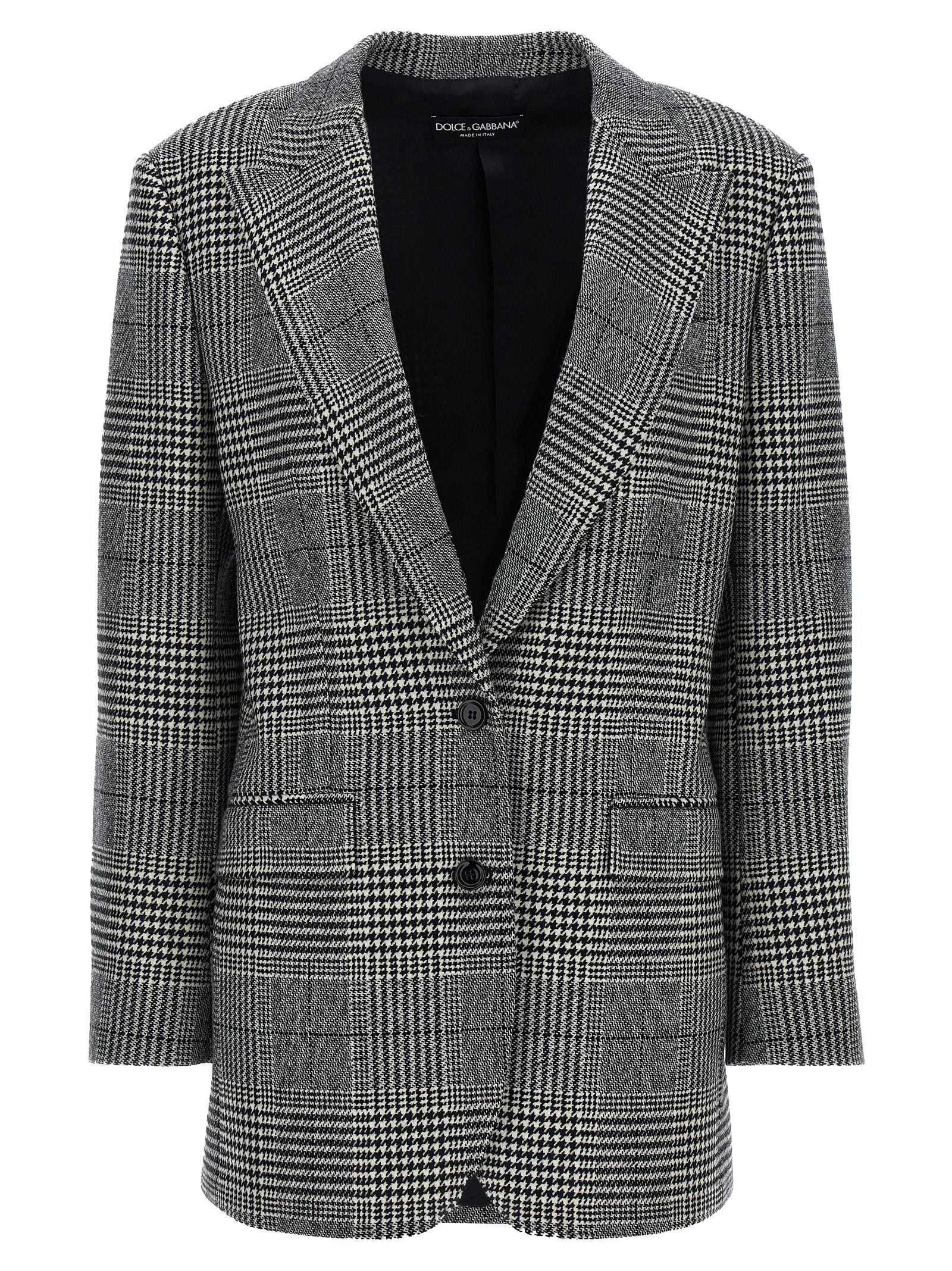 Blazer en laine bicolore Dolce & Gabbana porté sur mannequin, détails élégants et coupe moderne visible dans l'image.